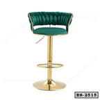 Modern green velvet bar stool with gold metal base and footrest, stylish seating for home or office