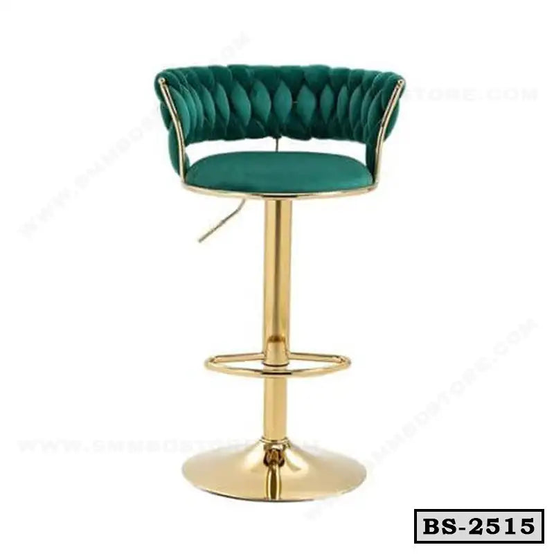 Modern green velvet bar stool with gold metal base and footrest, stylish seating for home or office