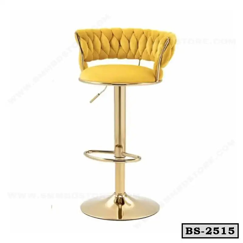 Modern yellow bar stool with tufted backrest and gold metal base, ideal for home or office.