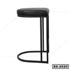 Modern black metal and leather bar stool with minimalist design, side view on white background