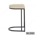 Modern bar stool with beige cushioned seat and black metal frame, minimalist design