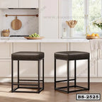 Modern black metal bar stools with square cushioned seats in a bright kitchen setting
