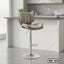 Modern beige bar stool with cushioned seat and chrome base in a kitchen setting