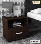Modern dark wood bedside table with drawer and open shelf, staged in a stylish bedroom.