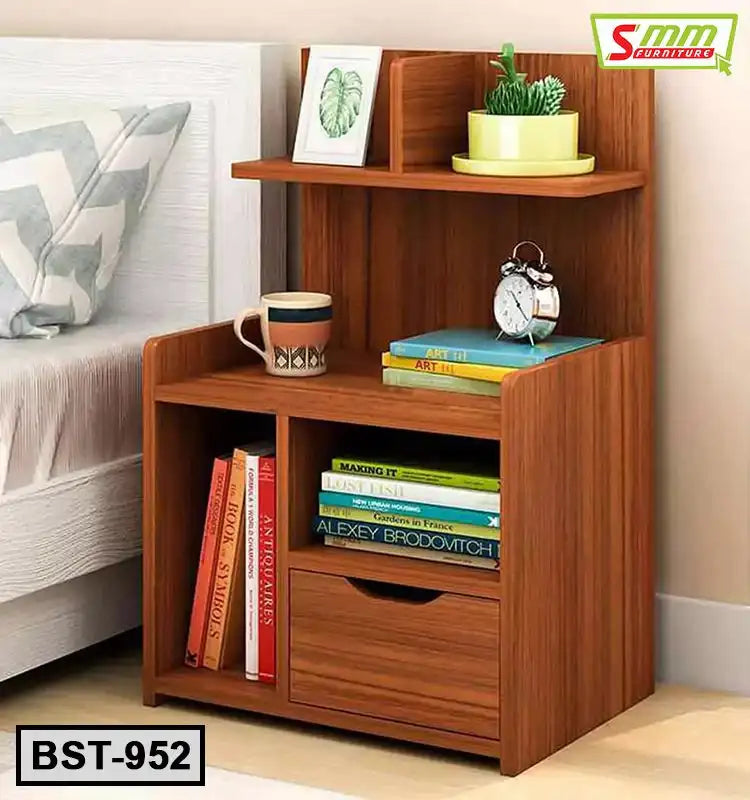 Wooden bedside table with shelves, a drawer, books, decor items, and a clock beside a bed. Main image