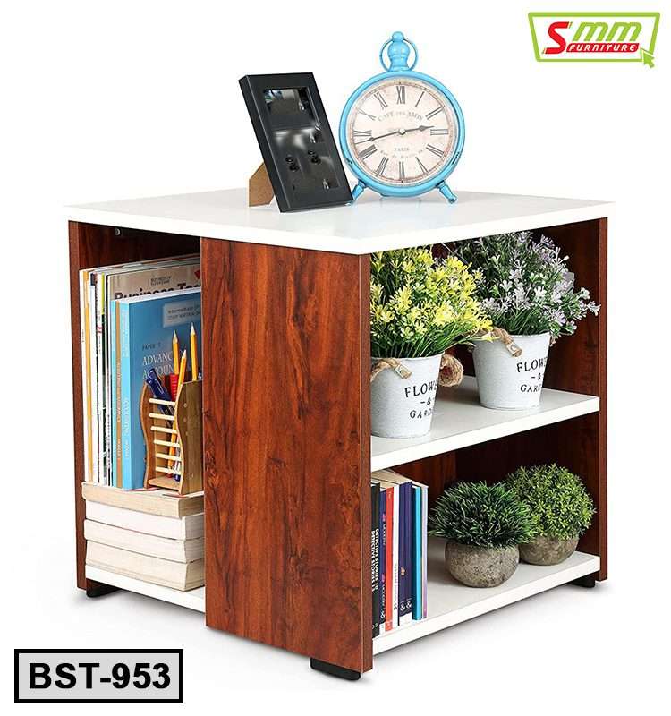 Wooden bedside table with books, potted plants, alarm clock, and photo frame Main image