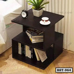 Modern wooden bedside table with books, clock, plant, and cup, perfect for bedroom decor.