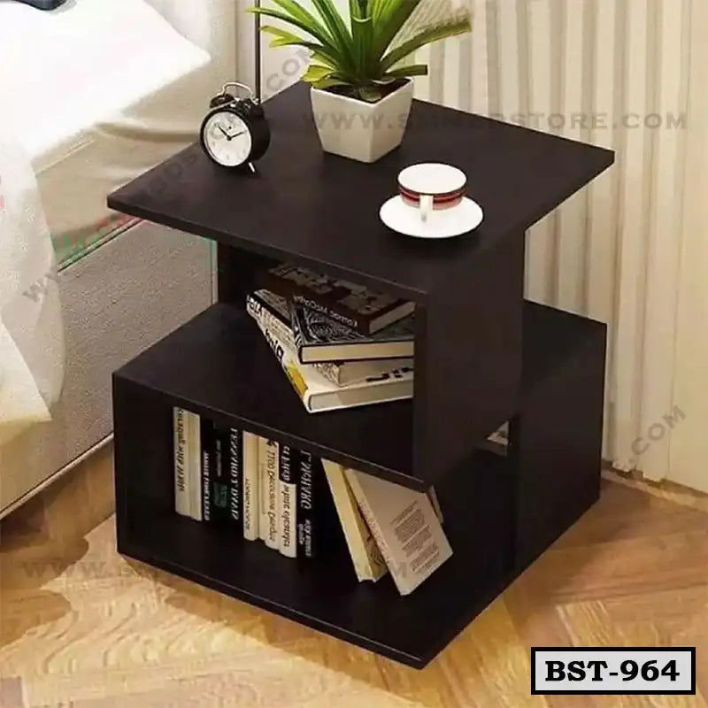 Modern wooden bedside table with books, clock, plant, and cup, perfect for bedroom decor.
