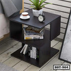 Modern dark wood bedside table with open shelves, alarm clock, plant, books, and cup