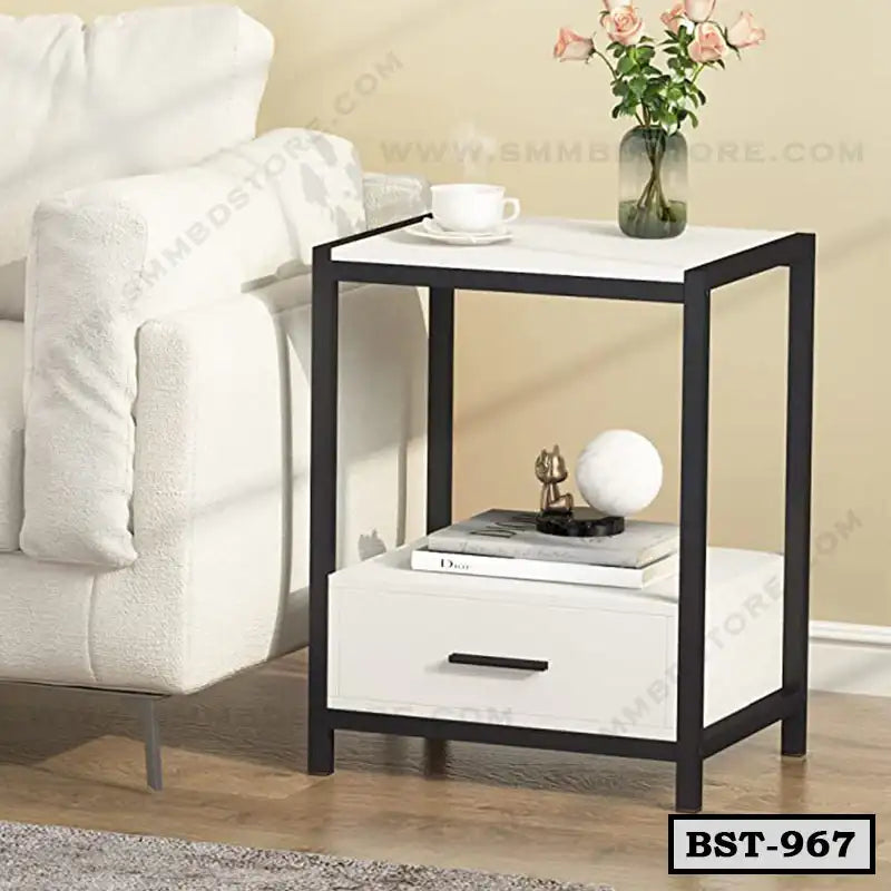 Modern bedside table with drawer, black frame, white finish, next to sofa, home interior Main image