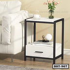 Modern bedside table with drawer, black frame, white finish, next to sofa, home interior