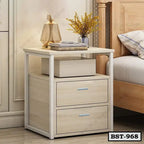 Modern wooden bedside table with two drawers, books, lamp, and vase in a bedroom setting.