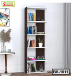 Modern bookshelf with five shelves, books, decor items, and a potted plant against a white wall.