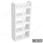 White decorative wooden bookshelf with intricate side patterns and six shelves