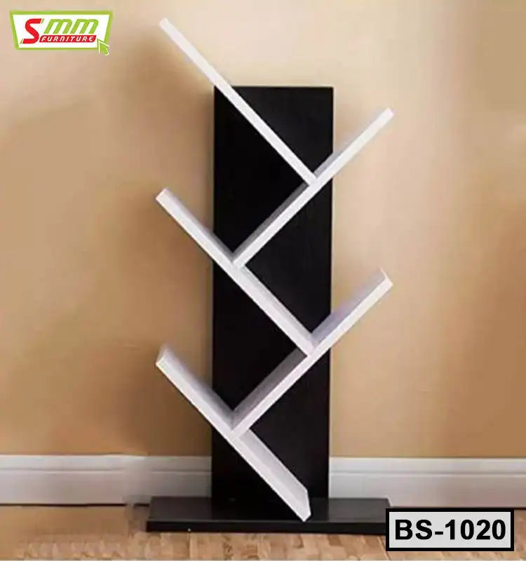 Modern geometric bookshelf with black base and angled white shelves against beige wall
