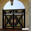 Decorative CNC cutting metal boundary gate with gold and black intricate patterns for home entrance.