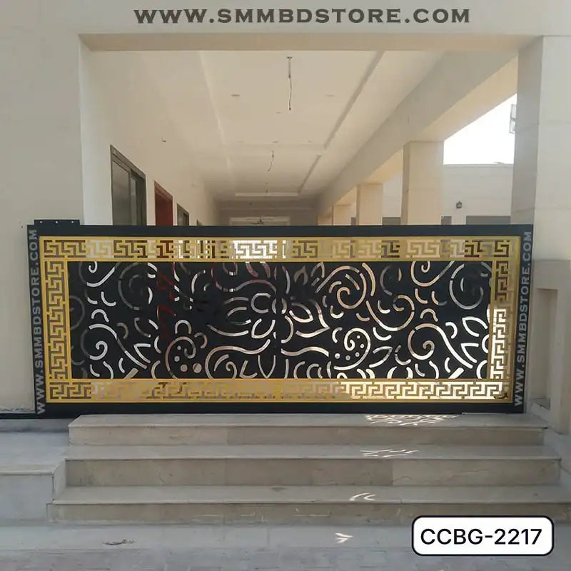 Modern CNC-cut metal boundary gate with black and gold floral patterns at building entrance Main image