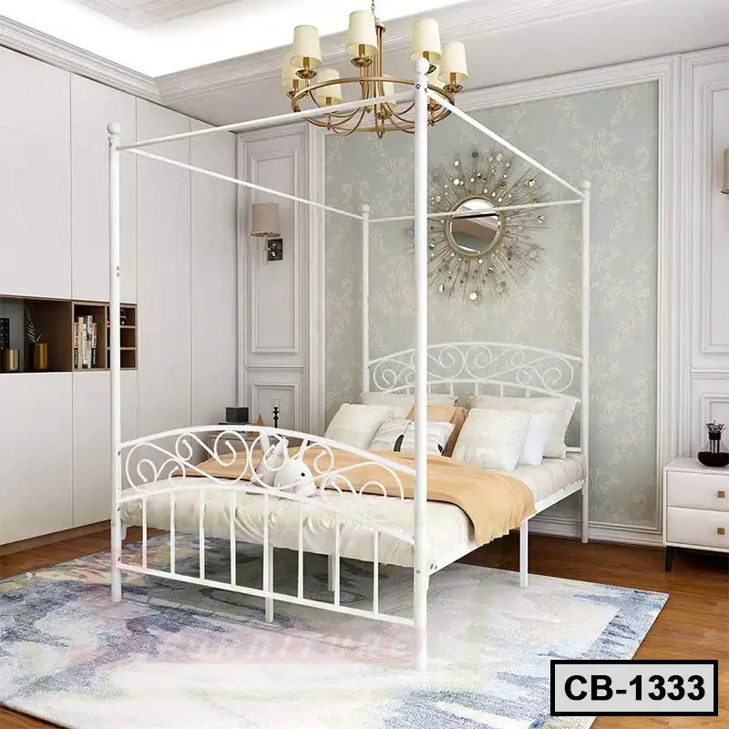 Modern white metal canopy bed frame in elegant bedroom with chandelier and wall decor