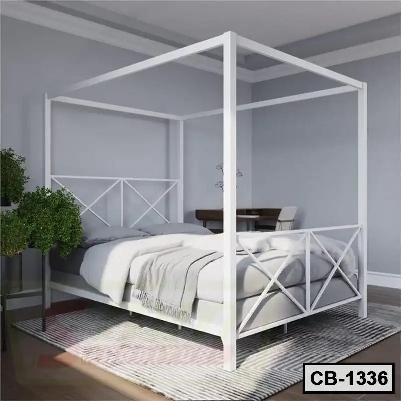 Modern white canopy bed frame in a contemporary bedroom on a striped rug with plants nearby Main image