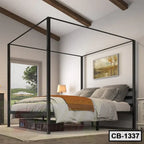 Modern black metal canopy bed frame in a bright, cozy bedroom with decor and large windows