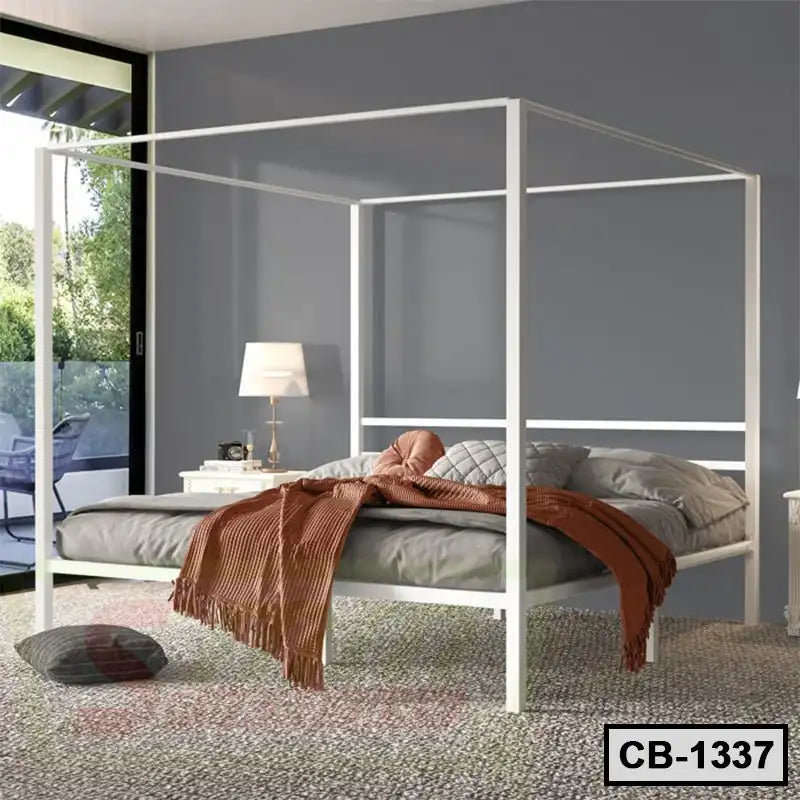 Modern white canopy bed frame in a stylish bedroom with gray walls and natural light