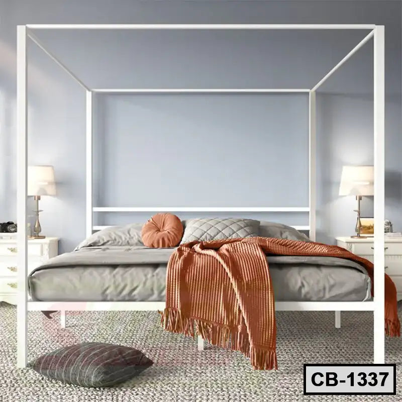 Modern white canopy bed frame with cozy bedding in a stylish bedroom setting