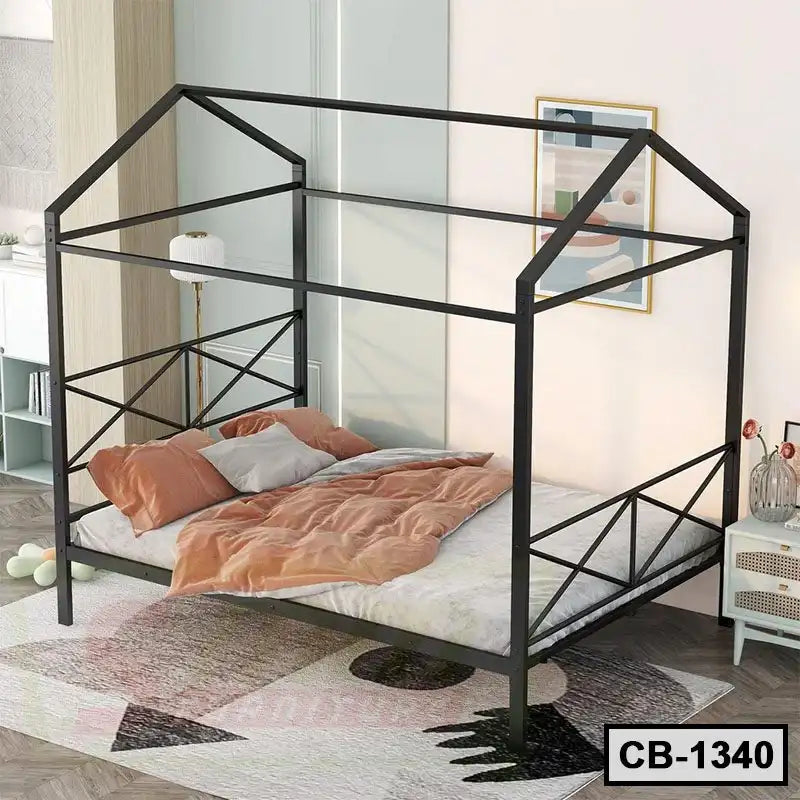 Modern black metal canopy bed frame with peach bedding in a stylish bedroom Main image