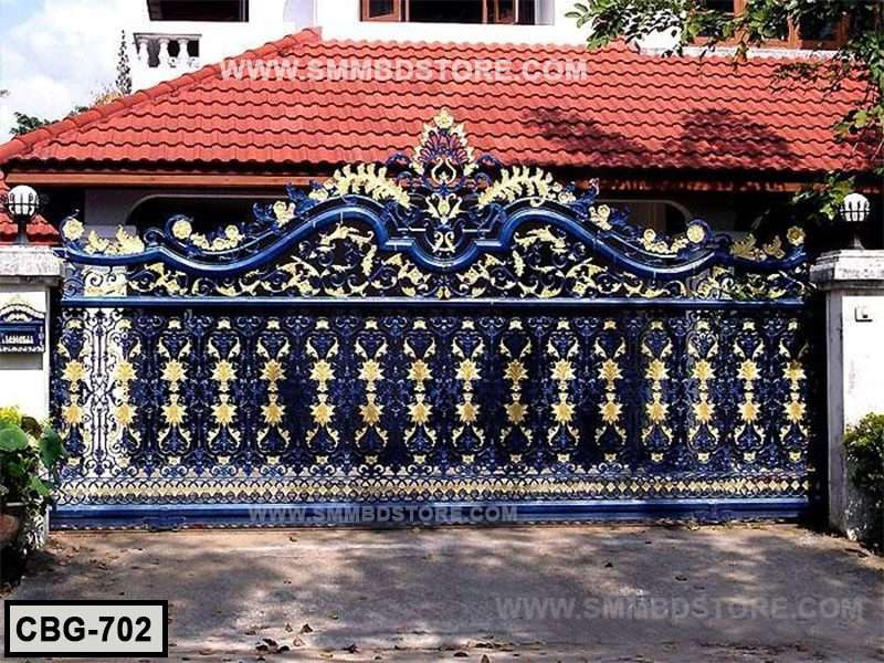 Ornate blue and gold cast iron boundary gate with decorative floral patterns outside a house Main image