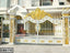 Elegant white and gold boundary gate with ornate decorative casting for modern home entrance
