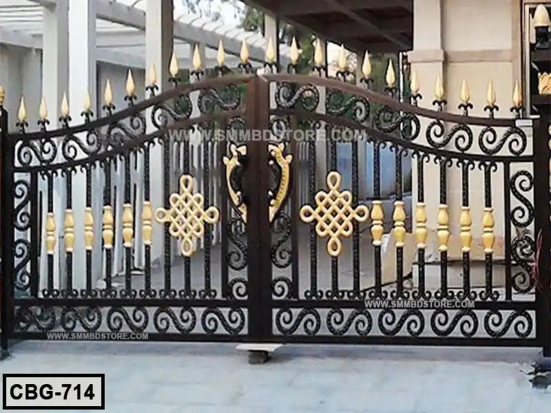 Ornate black and gold metal boundary gate with decorative scrollwork and geometric patterns Main image