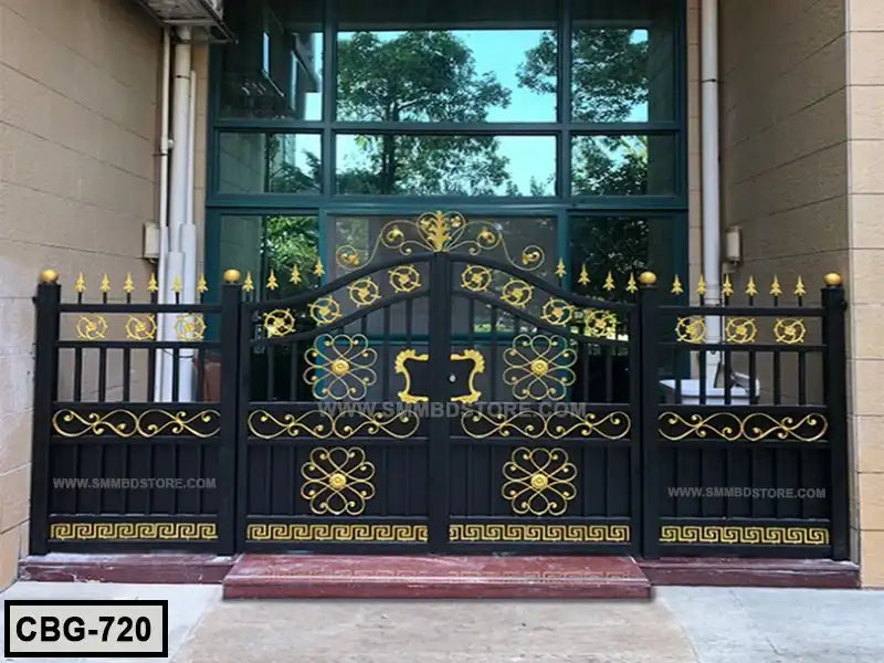 Modern black metal boundary gate with gold floral and geometric designs, placed outdoors.