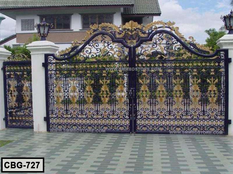 Decorative wrought iron boundary gate with gold floral designs in front of a house Main image