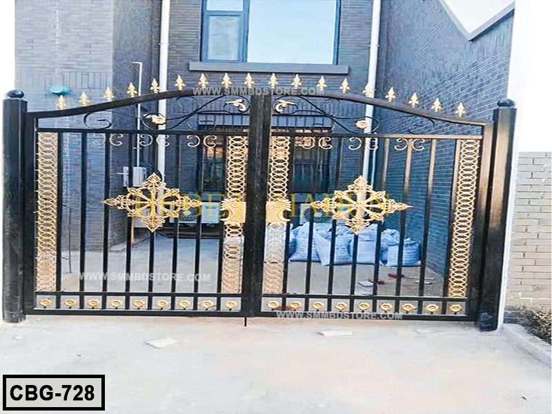 Modern black and gold boundary gate with decorative metalwork at house entrance Main image