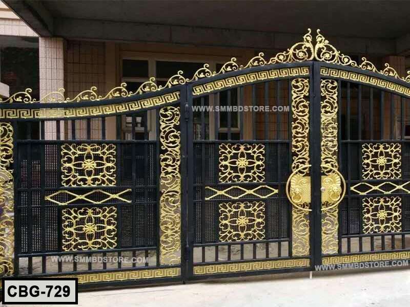 Decorative black and gold metal boundary gate with ornate floral patterns, outdoor setting Main image