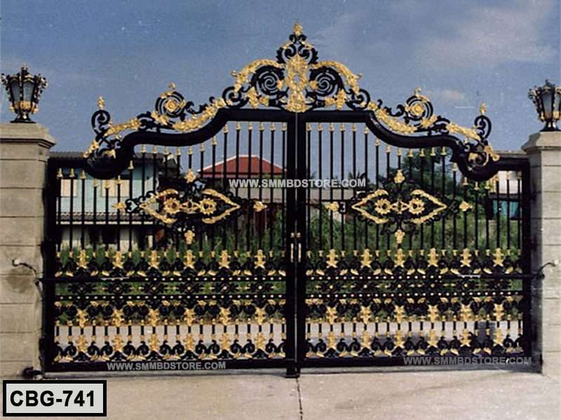 Decorative black and gold wrought iron boundary gate with ornate patterns, outdoor setting Main image