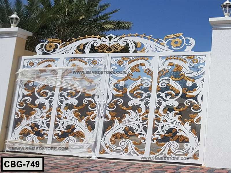 Ornate white and gold decorative metal boundary gate with floral patterns, outdoor setting