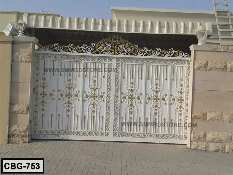 Decorative white metal boundary gate with gold accents installed at a house entrance