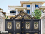 Luxury black and gold boundary gate with ornate design in front of modern house