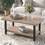 Modern wooden center table with black legs in a living room, decorated with a flower vase and tray.