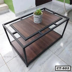 Modern rectangular center table with black metal frame and wooden shelves, indoor setting