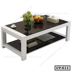Modern rectangular center table with black glass top, white frame, and shelf for living room