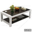 Modern rectangular center table with black glass top, white frame, and shelf for living room
