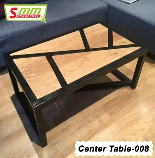 Modern rectangular center table with wood top and black metal frame, placed on wood floor near sofa.