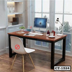 Modern computer table with wooden top and black metal legs in a home office setup