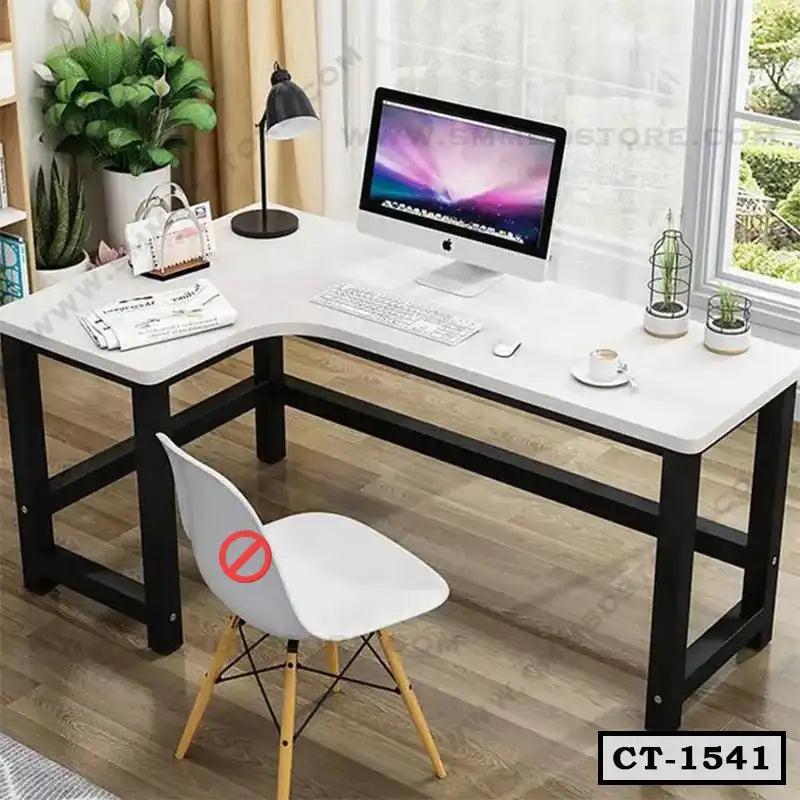 Modern L-shaped computer table with black frame, white top, office chair and desktop setup