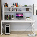 Modern computer table with bookshelves, desktop computer, plants, and storage shelves