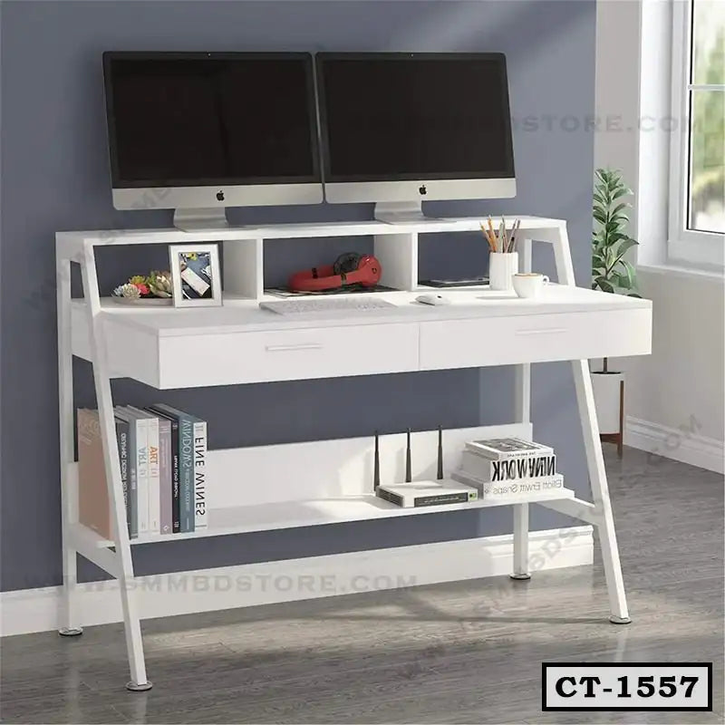Modern white computer table with storage shelves, dual monitors, books, and office accessories