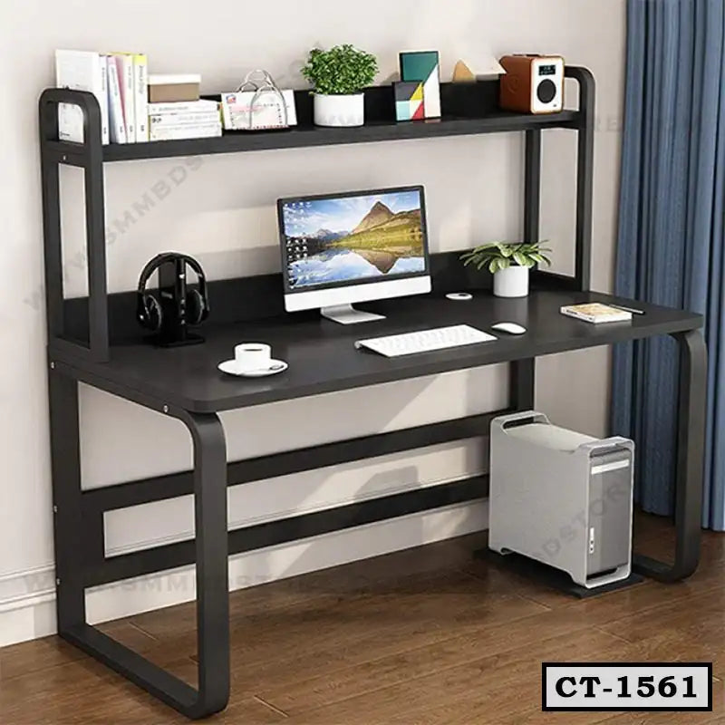 Black computer table with shelf, desktop setup, books, decor, and CPU on wooden floor