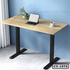 Modern computer table with light wood top, black metal legs, laptop, mug, and vase in office setting