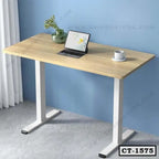 Modern wooden computer table with white metal legs, laptop, mug, and vase in home office setting